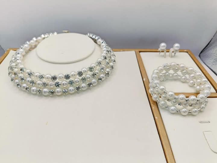 Three layered set necklace, bangle and earring.